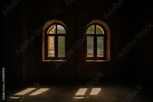 sunny day through the window. dark space lighted by the sun. High quality photo