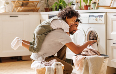 Father and son doing laundry together