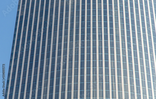Glass walls of a skyscraper as a background.