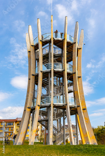 Fototapeta Naklejka Na Ścianę i Meble -  Modernistic sightseeing tower and platform over touristic promenade at Jezioro Elckie lake shore in Masuria region of Poland