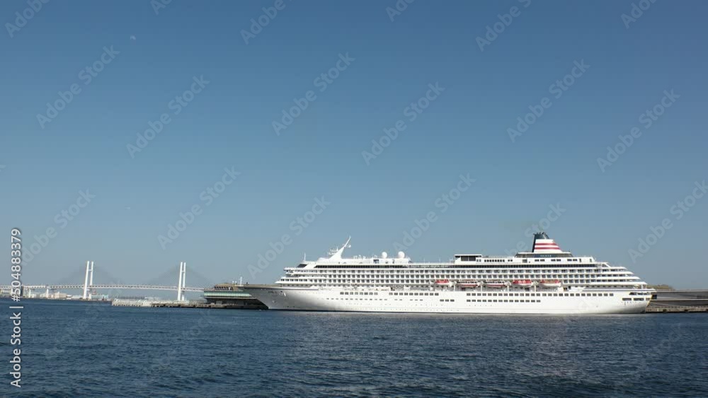 YOKOHAMA, KANAGAWA, JAPAN - APRIL 2022 : View of Cruise Ship at Osanbashi Pier. It is the biggest cruise ship in Japan that is registered in Yokohama. YOKOHAMA, KANAGAWA, JAPAN - APRIL 2022 : View of Cruise Ship at Osanbashi Pier. It is the biggest cruise ship in Japan that is registered in Yokohama.
