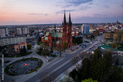 Holy Family Cathedral Church in Tarnow, Poland. Skyline of City Illuminated at Dusk. Cityscape and Architecture from Above.