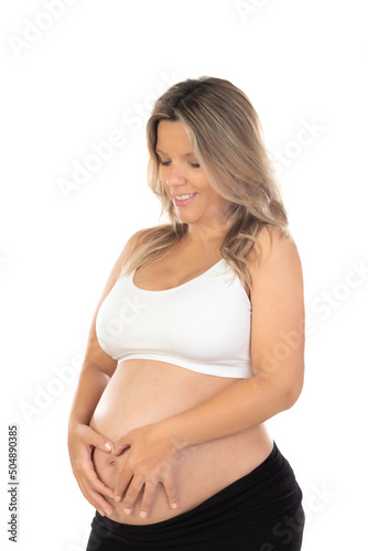 Young beautiful blonde woman pregnant expecting baby over isolated white background with a happy and cool smile on face. © Gelpi