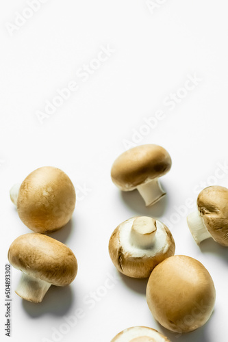 Close up view of ripe mushrooms on white background with copy space.
