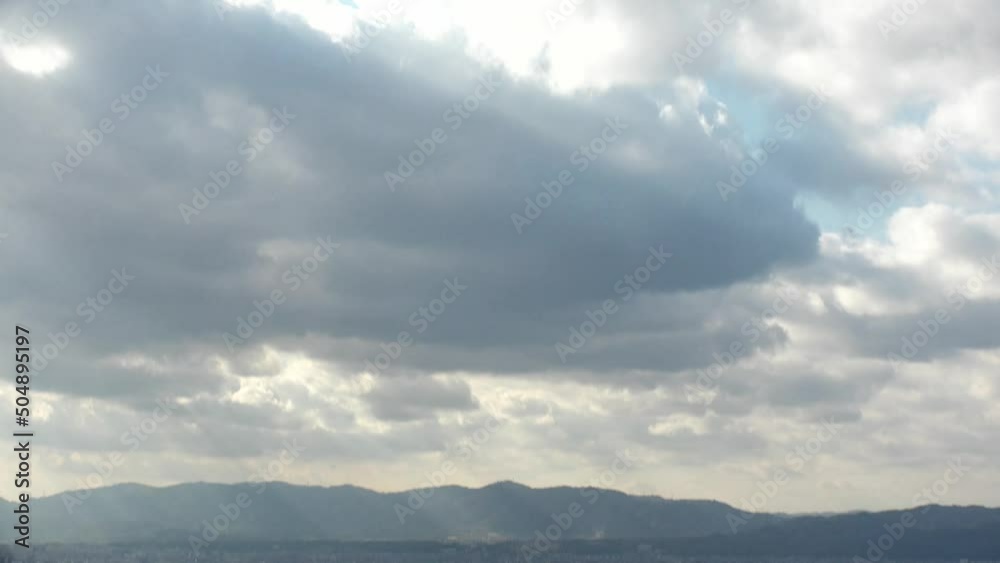 KYOTO, JAPAN - DEC 2021 : Aerial panoramic view of Kyoto city in daytime. Scenery of mountain, streets and buildings around downtown area. Japanese nature and traditional old town concept video. KYOTO, JAPAN - DEC 2021 : Aerial panoramic view of Kyoto city in daytime. Scenery of mountain, streets and buildings around downtown area. Japanese nature and traditional old town concept video.