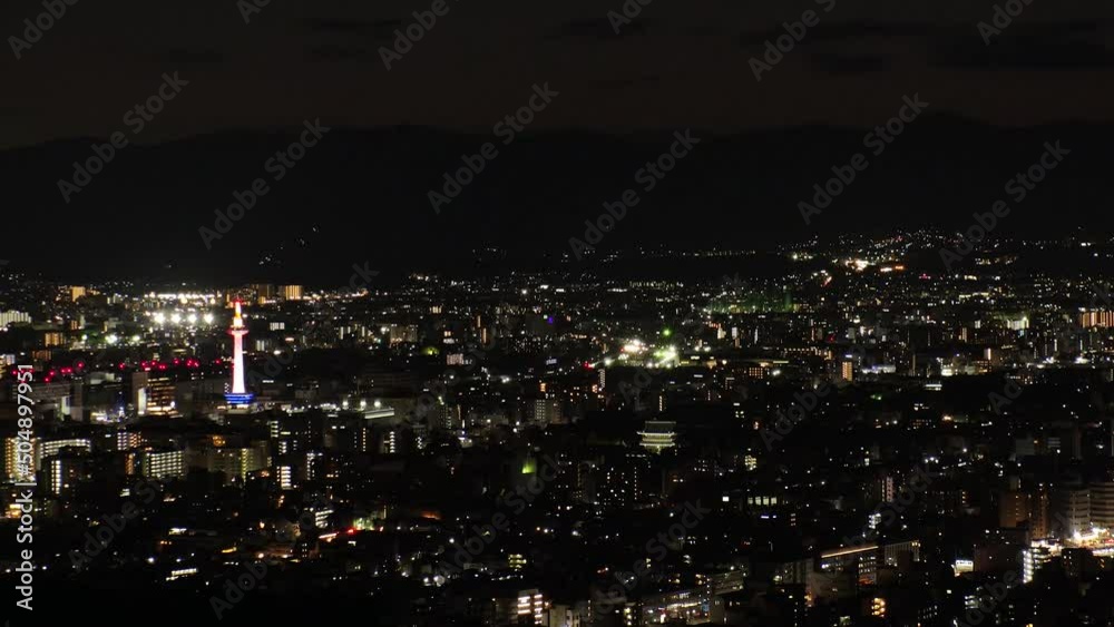 KYOTO, JAPAN - DECEMBER 2021 : Aerial high angle view of Kyoto city at night. Scenery of streets and buildings around Kyoto station. Time lapse shot. Japanese urban nightlife city concept video. KYOTO, JAPAN - DECEMBER 2021 : Aerial high angle view of Kyoto city at night. Scenery of streets and buildings around Kyoto station. Time lapse shot. Japanese urban nightlife city concept video.