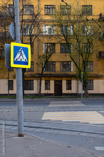 road sign at a pedestrian crossing in the old city district
