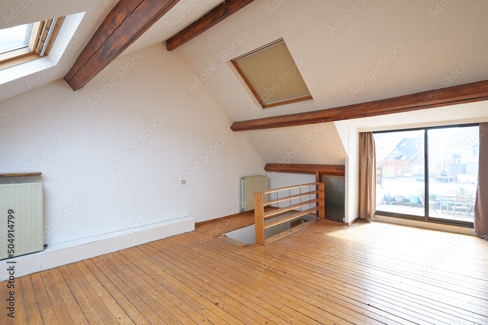 Fototapeta premium Interior attic windows and hardwood floor
