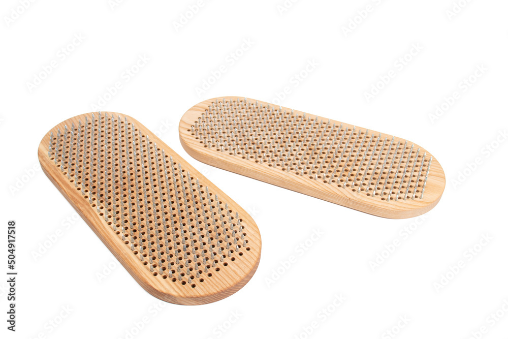 Sadhu board isolated on white background. The practice of standing on nails. Yoga concept. Sadhu board isolated on white background. The practice of standing on nails. Yoga concept.