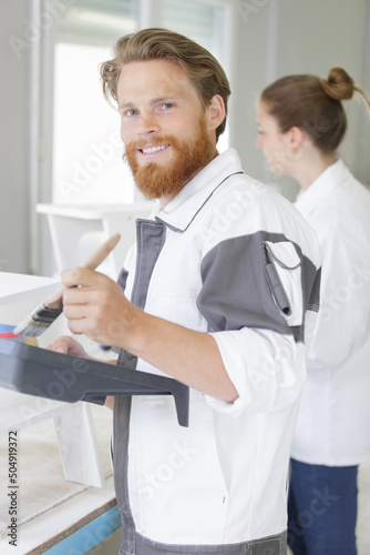 painter men mixing paint at work
