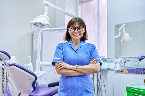 Portrait of smiling nurse looking at camera in dentistry.