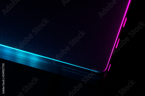 Computer or laptop close up with neon cyber punk color