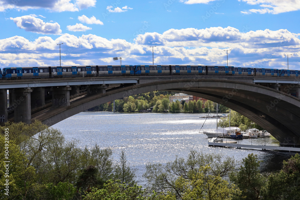 Stockholm, Sweden A tunnelbana or subway train on the Traneberg bridge.