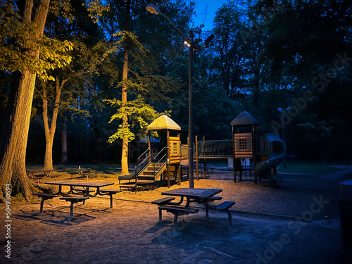 Children’s playground equipment in the park at night. Haddon Heights, New Jersey. photo