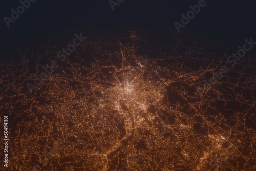 Aerial shot of Manchester (New Hampshire, USA) at night, view from south. Imitation of satellite view on modern city with street lights and glow effect. 3d render photo