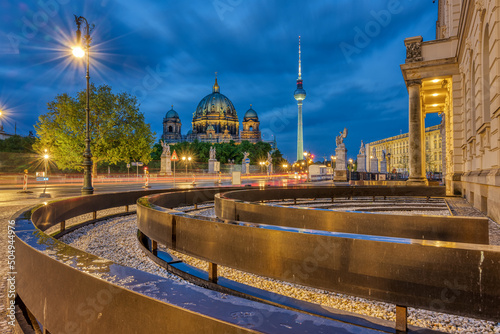 View of Unter den Linden boulevard in Berlin at night with the TV Tower and the cathedral in the back