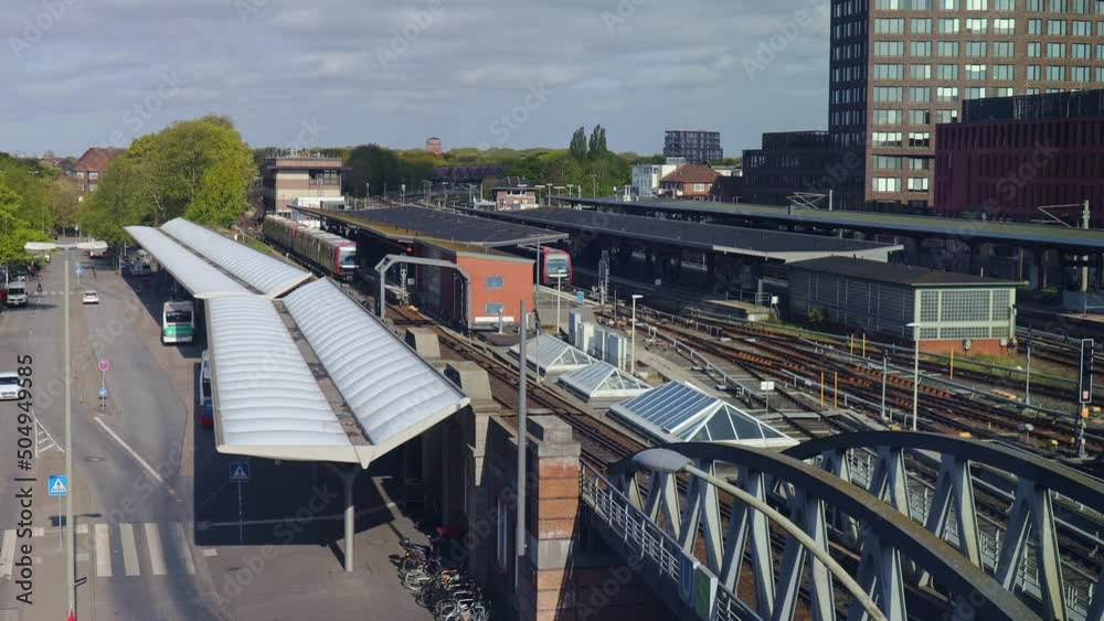 Trains and busses entering and leaving Barmbek station in Hamburg, as seen from above Trains and busses entering and leaving Barmbek station in Hamburg, as seen from above