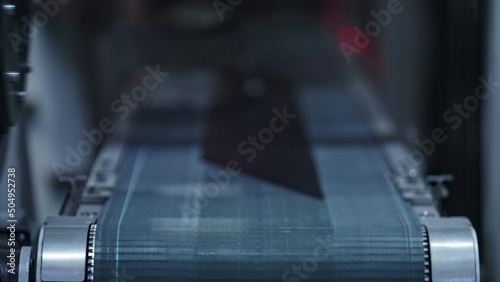 Photos Closeup tire conveyor belt at modern industrial manufacture working process