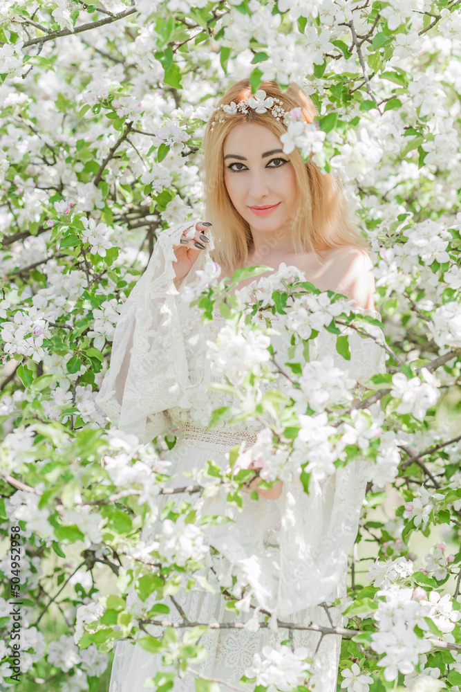 Bride at spring garden. Beautiful mix race lady in romantic lace dress with make up and flower wreath Bride at spring garden. Beautiful mix race lady in romantic lace dress with make up and flower wreath