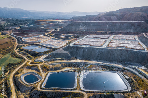 Leaching heaps and storage reservoirs at ore processing plant. Skouriotissa copper mine in Cyprus photo