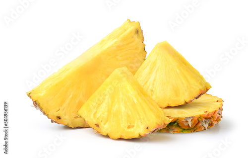 Pineapple with cut in half and slices isolated on white background.
