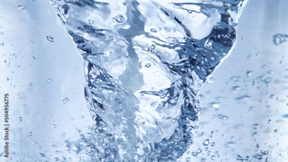 Super Slow Motion Shot of Water Whirl on Light Blue Background at 1000fps. Super Slow Motion Shot of Water Whirl on Light Blue Background at 1000fps.