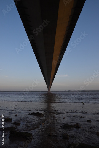 the Humber bridge crossing the river Humber during sunset