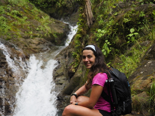 young woman hiking in the jungle in costa rica