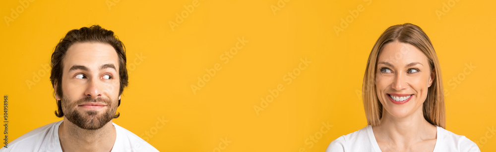 Happy handsome funny young european guy with stubble in white t-shirt and female looks at free space