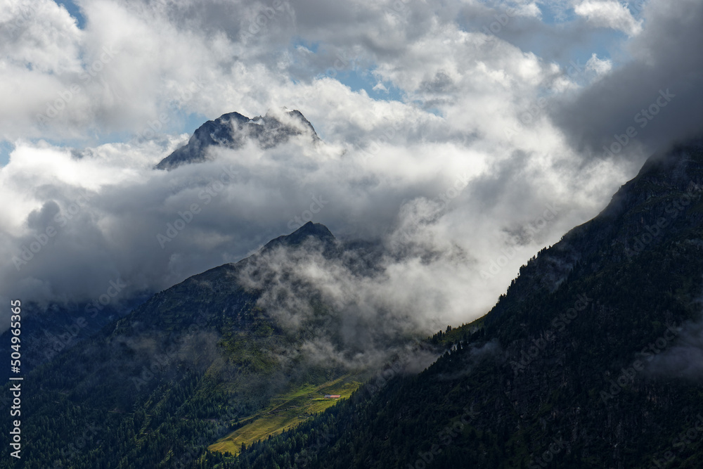 Dramatic fog and cloud covered peaks of the Oetztal Alps, Tyrol, Austria Europe