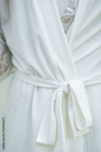 The bride's white robe, close-up.