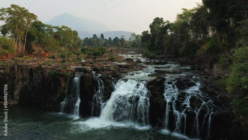 The magnificent Tad Lo waterfalls in Asia, Laos, Champassak, on the Bolovens plateau, on a sunny day. photo