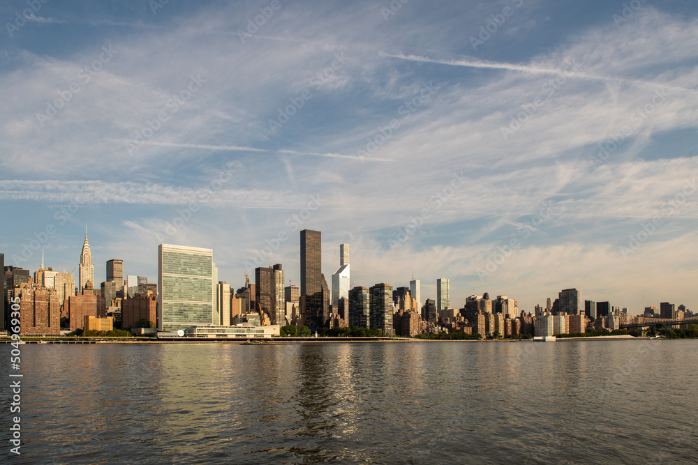 Manhattan skyline at sunrise, seen from Long Island City, Queens, New York.