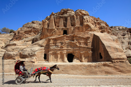 Horse Carriage passing in front of the Obelisk tomb, Petra, Jordan