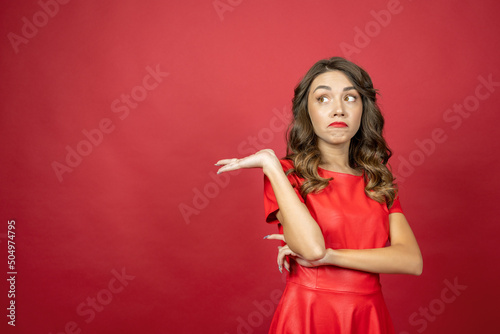 Woman is disappointed on a red background