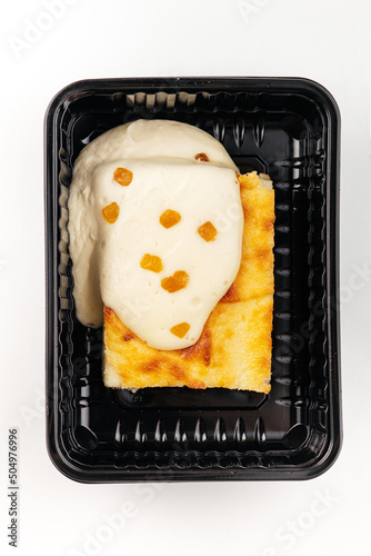 casserole with sour cream in a container