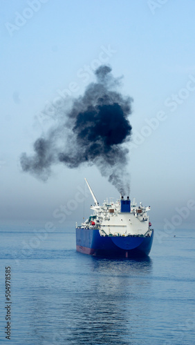 Black smoke from a ship at sea