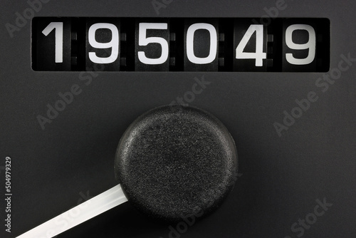 odometer of used car showing mileage of 195049 km photo