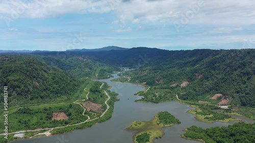 The reservoir of a hydraulic power station on the Nam Theun in Asia, in Laos, in Khammouane, towards Thakek, on a sunny day. photo