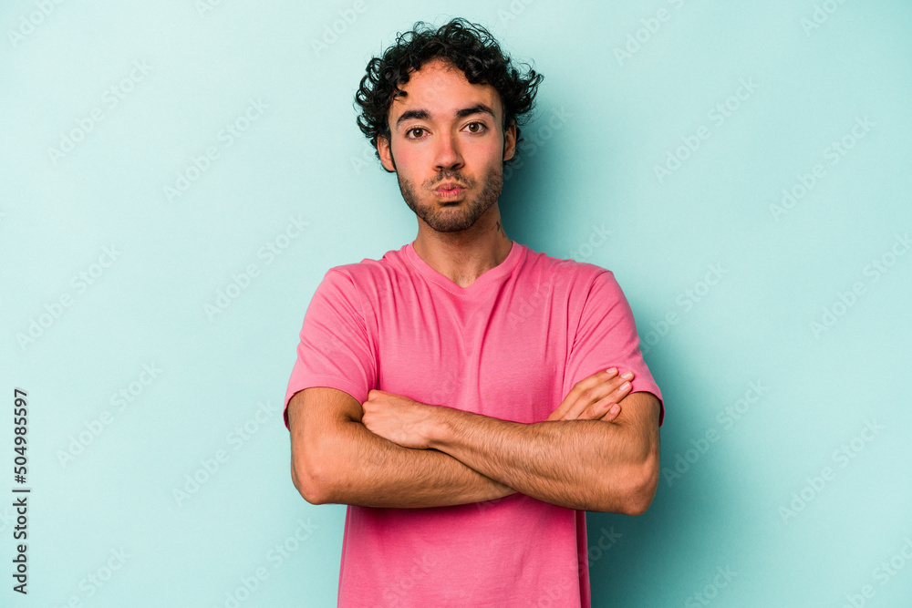 Young caucasian man isolated on white background blows cheeks, has tired expression. Facial expression concept. Young caucasian man isolated on white background blows cheeks, has tired expression. Facial expression concept.