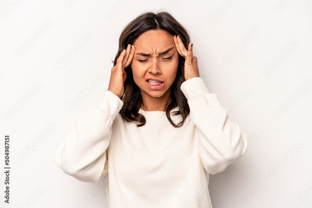 Young hispanic woman isolated on white background touching temples and having headache. Young hispanic woman isolated on white background touching temples and having headache.
