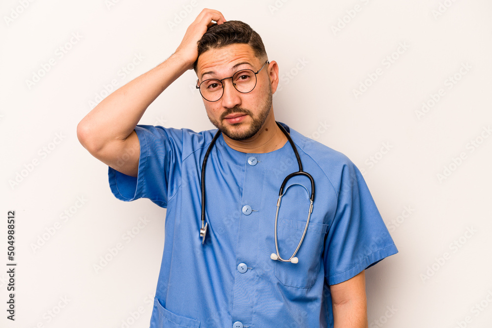 Hispanic nurse man isolated on white background being shocked, she has remembered important meeting. Hispanic nurse man isolated on white background being shocked, she has remembered important meeting.