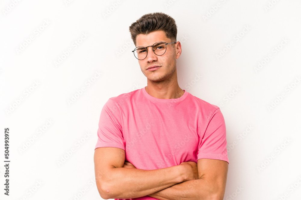 Young caucasian man isolated on white background who is bored, fatigued and need a relax day. Young caucasian man isolated on white background who is bored, fatigued and need a relax day.