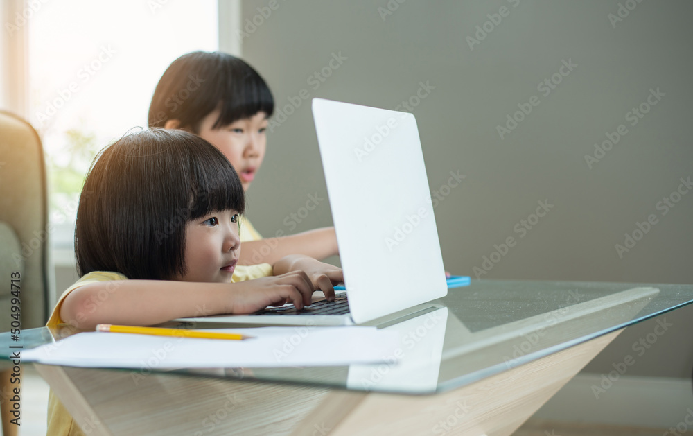 Asian boy student online learning class study online video call zoom teacher, Happy boy learn english language online with laptop at home.New normal.Covid-19 coronavirus.Social distancing.stay home Asian boy student online learning class study online video call zoom teacher, Happy boy learn english language online with laptop at home.New normal.Covid-19 coronavirus.Social distancing.stay home