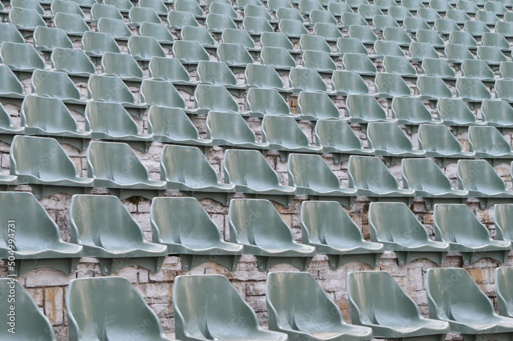 Naklejka premium Rows of empty plastic chairs for open-air theater audiences