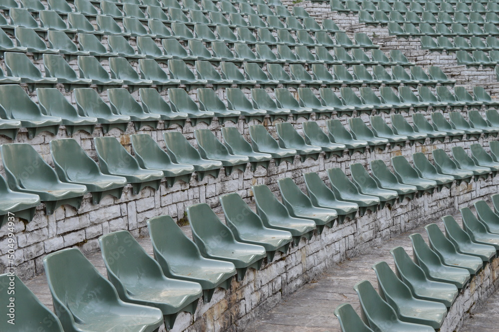 Rows of empty plastic chairs for open-air theater audiences Rows of empty plastic chairs for open-air theater audiences