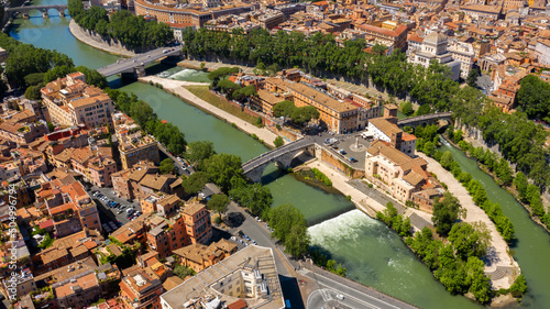 Aerial view of Tiber Island, the only river island in the part of the Tiber which runs through Rome, Italy. In the period of ancient Rome, the temple of Asclepius stood here