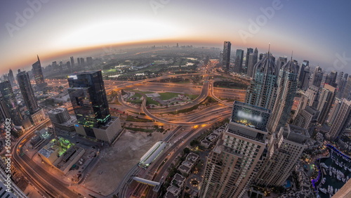 Dubai marina and JLT skyscrapers along Sheikh Zayed Road aerial night to day timelapse. © neiezhmakov