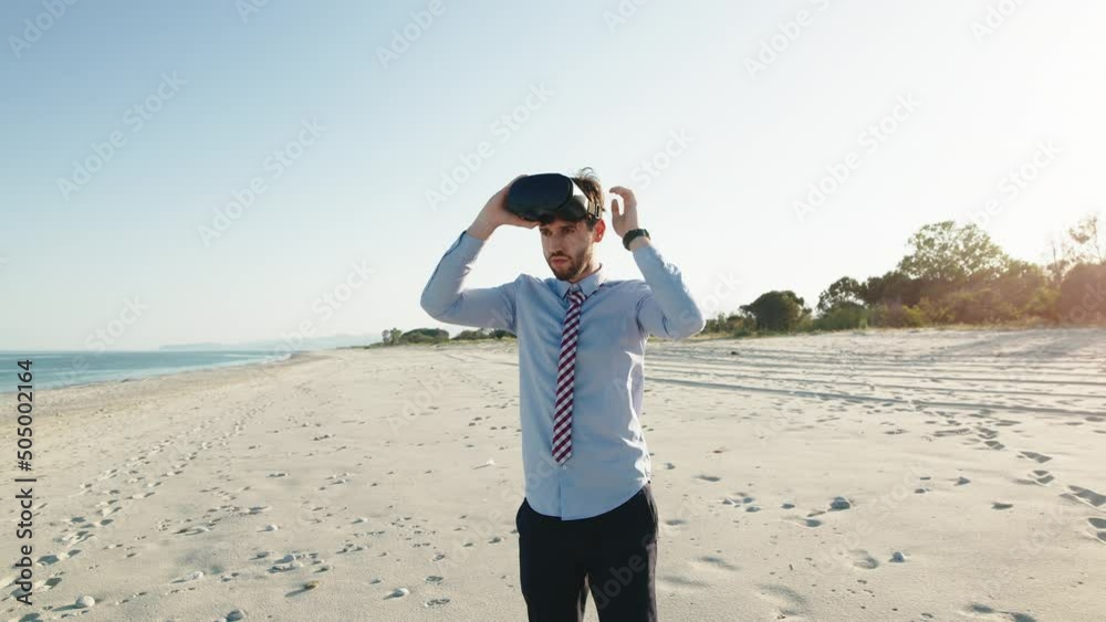 Business man in shirt wears virtual reality glasses at the beach Business man in shirt wears virtual reality glasses at the beach