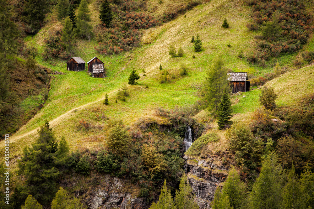 Φωτογραφία Barns on a grassy hillside in the Italian Dolomites near the town of Cortina d'A